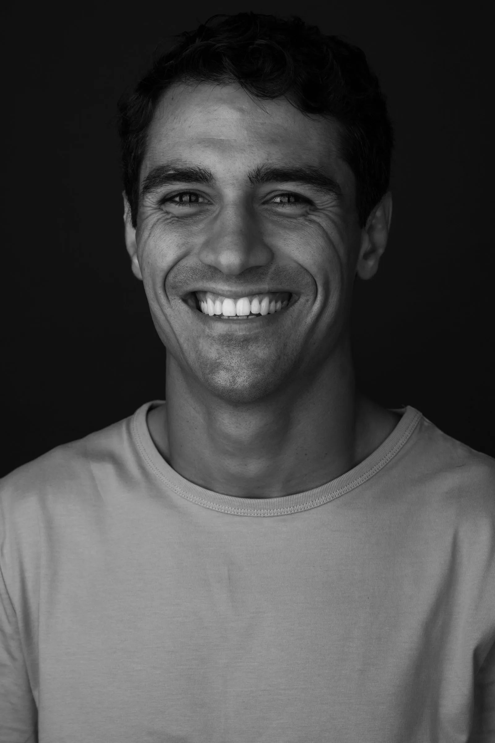Black and white studio portrait of Rui Botelho